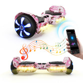 The iHoverboard Hoverboard for Kids Aged 6+ (6.5"-H2) in pink camo is shown with LED lights and a smartphone, highlighting Bluetooth speaker connectivity and self-balancing tech for safe, fun rides.